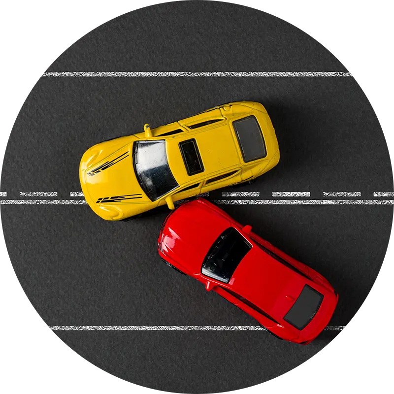 Red and yellow toy cars in a mock accident